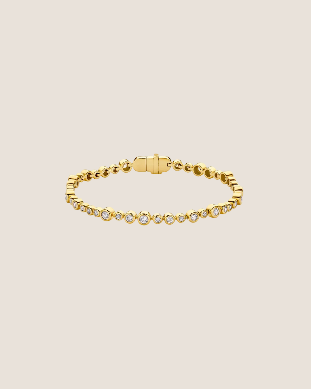 A gold tennis bracelet featuring small round-cut clear gemstones set along the front, displayed on a clean white background.