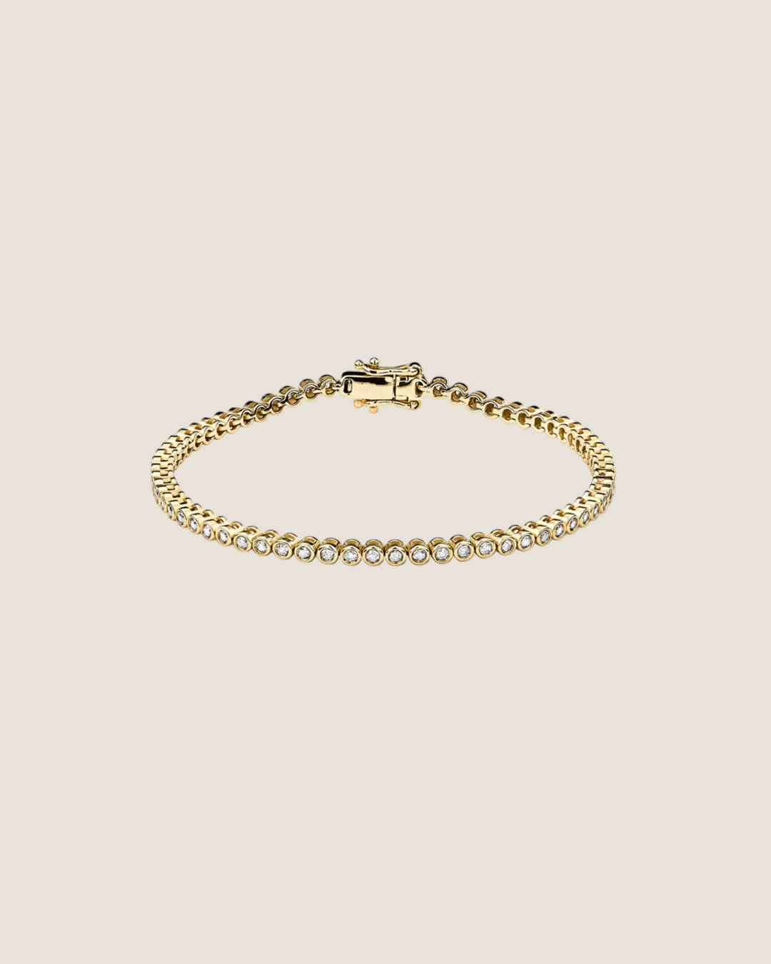 A gold tennis bracelet with a row of clear stones along the front, displayed on a clean white background.