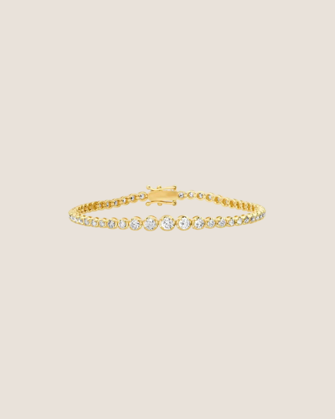 A delicate yellow gold tennis bracelet featuring a row of round-cut clear gemstones, displayed on a clean white background with a soft reflection.